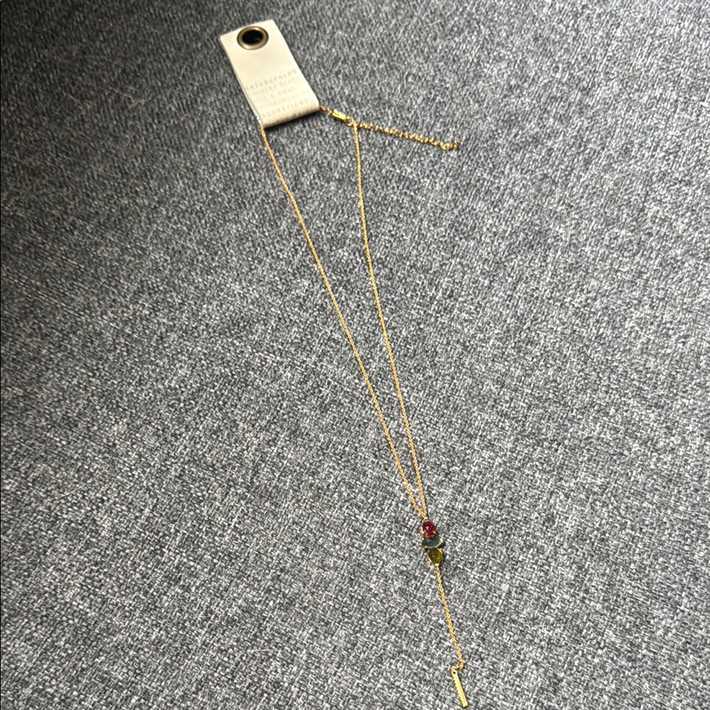 Elegant Gold Necklace with Red and Green Accents